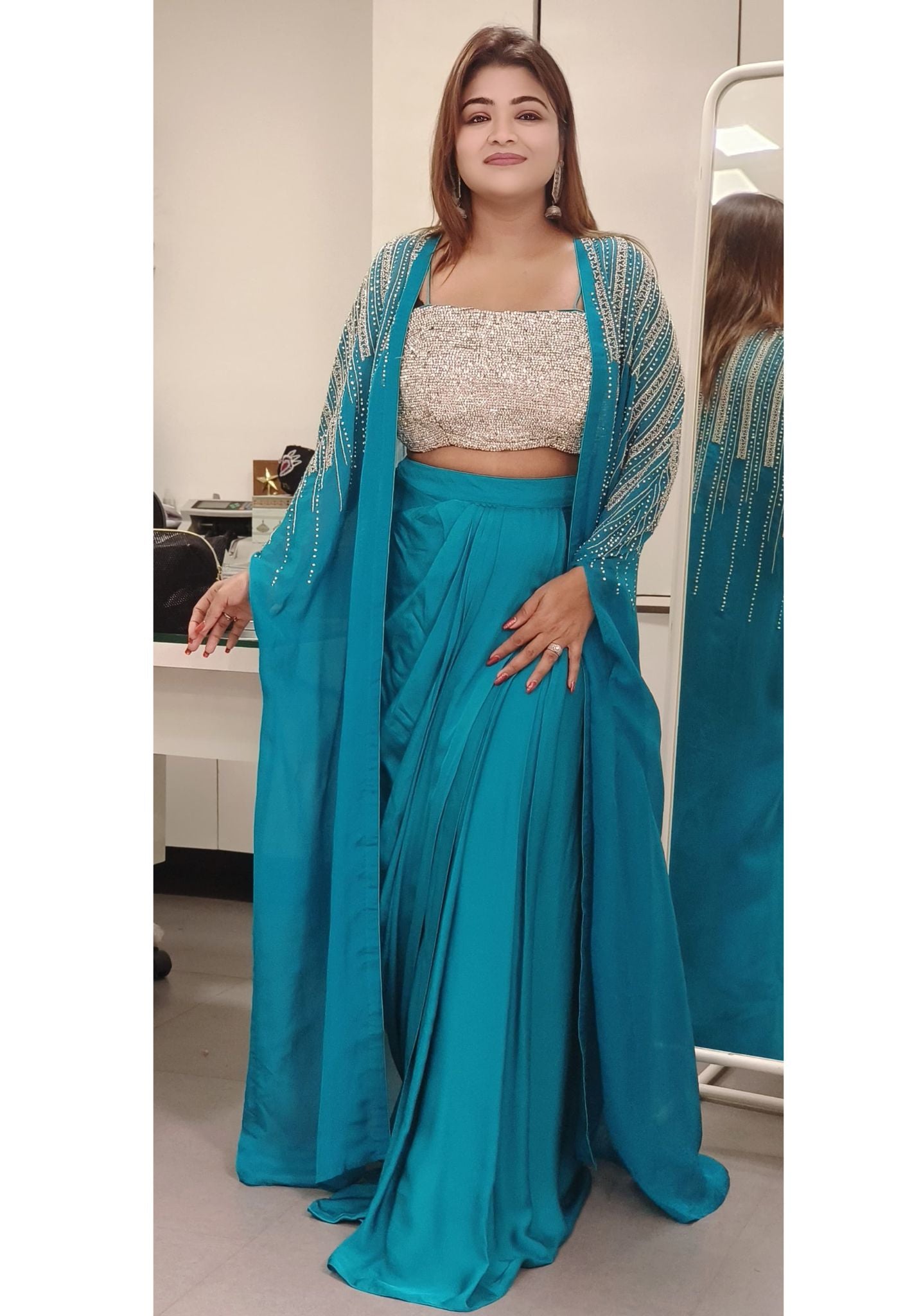 Swarovski-Embellished Top with Draped Skirt Set With organza shrug A luxurious outfit featuring a sparkling Swarovski stone-studded blouse paired with an elegant drape-style skirt DRY WASH