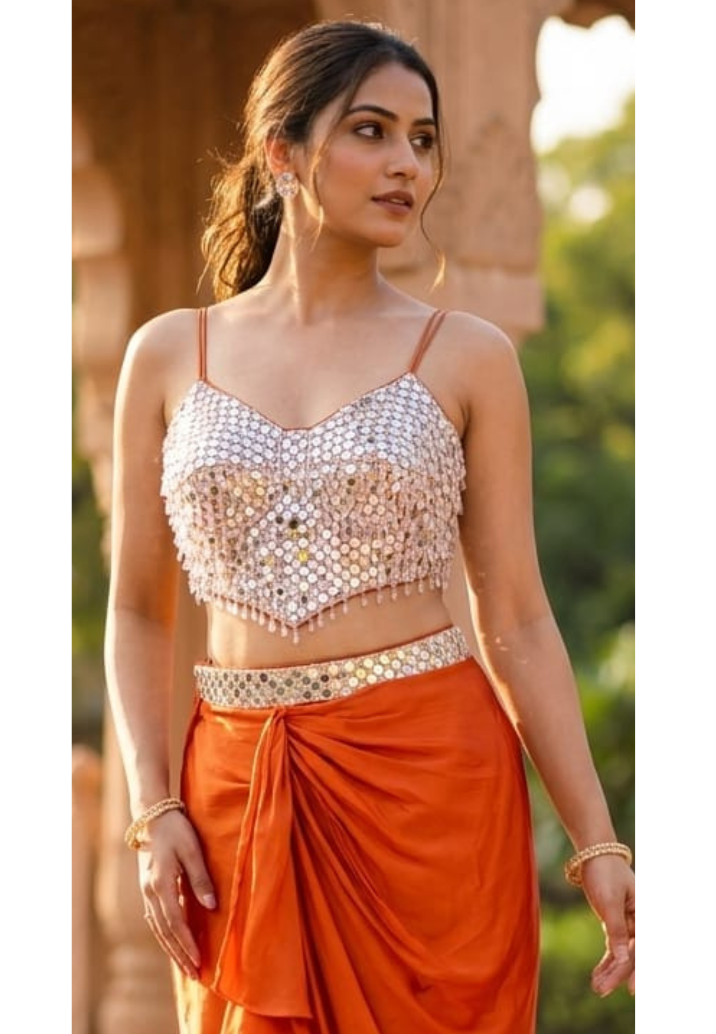 Burnt Orange Pre-Draped Satin-Crepe Dhoti Skirt with Ruffle Detailing paired with a Heavily Embellished Silver Mirror-Work Camisole Crop Top- 14229
