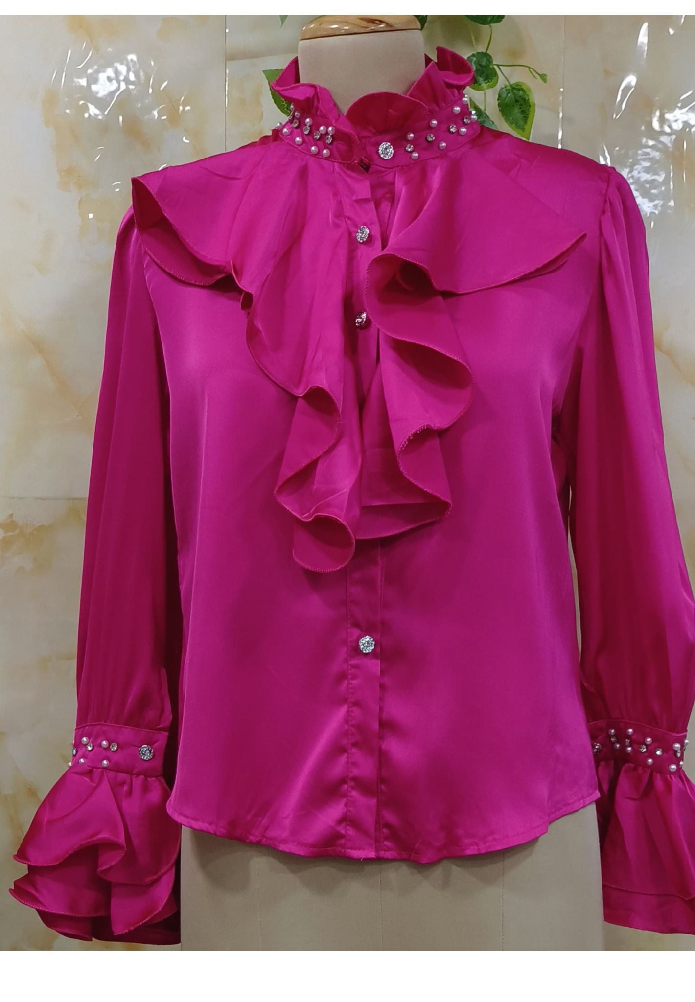 High ruffled collars with pearl embellishments-