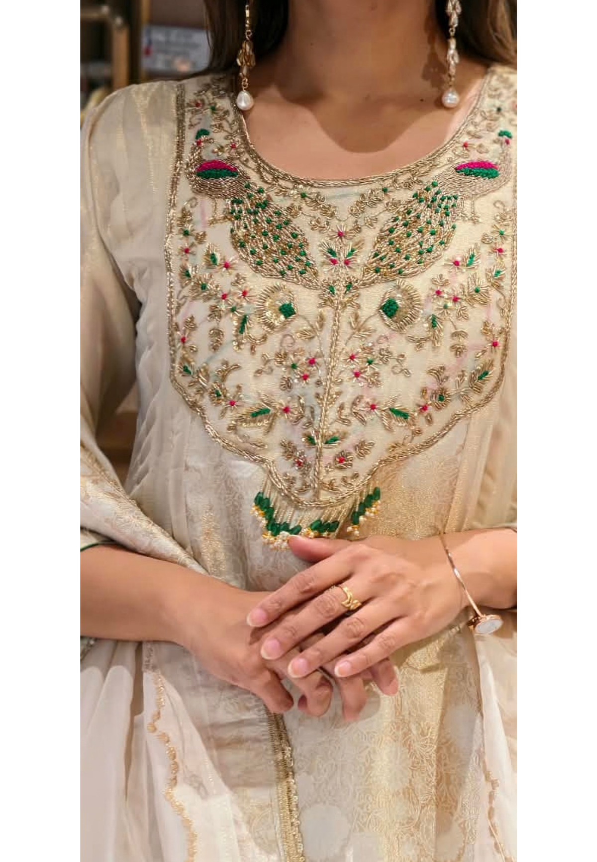 Traditional Brocade and Tissue Silk Anarkali Suit featuring Peacock Zardozi Work and Emerald Bead Accents- 16585