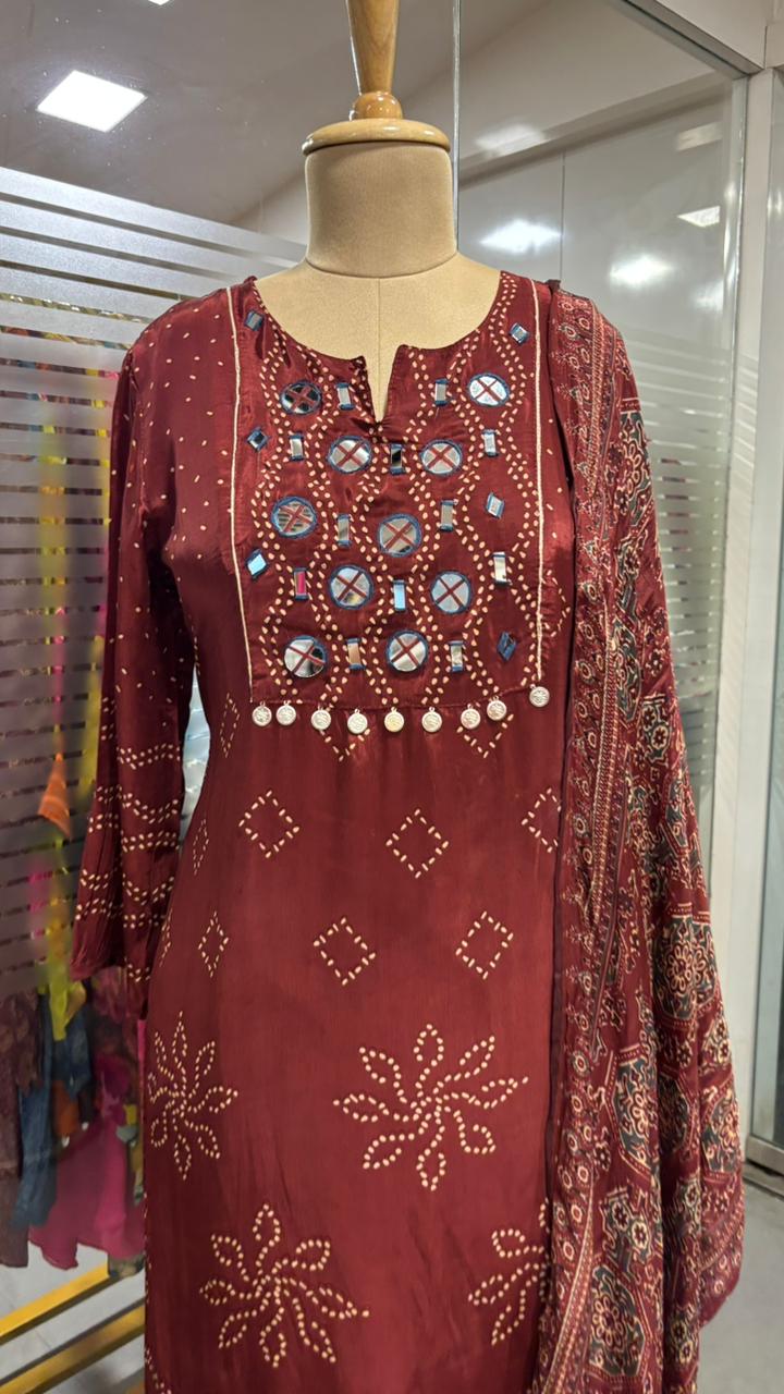 Beautiful Foil Mirror Work Tasselled Full Suit With Ajrak Print Dupatta In Crepe Fabric