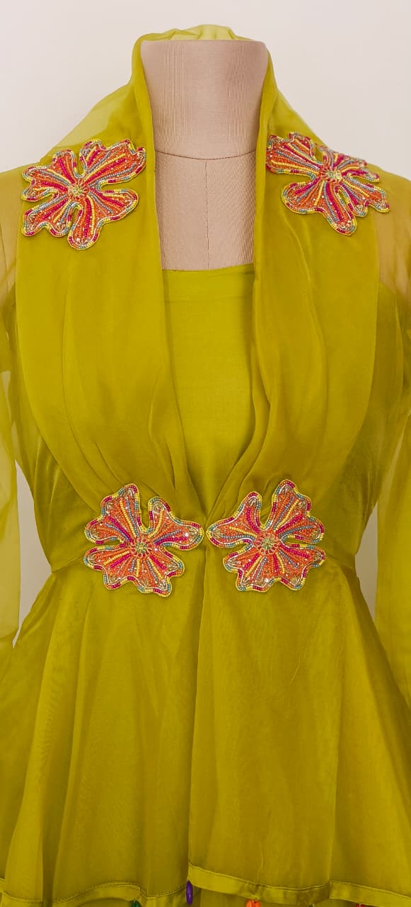 Contemporary Lime Green Peplum Kurta and Palazzo Set with Intricate Floral Work and Playful Tassel Highlights