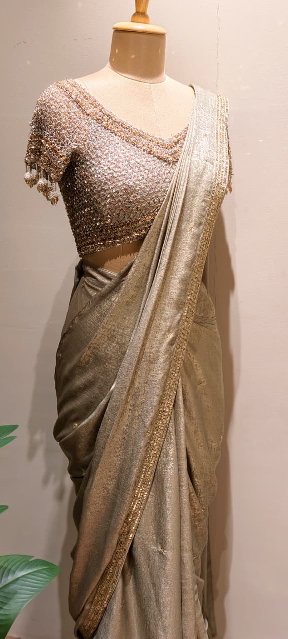 Metallic Gold-Taupe Shimmer Tissue Saree with Embellished Border paired with a Heavy Sequin and Pearl-Fringed Blouse- 14236