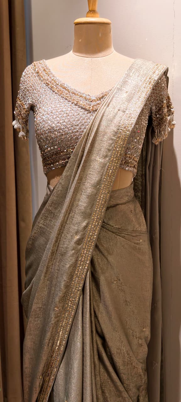 Metallic Gold-Taupe Shimmer Tissue Saree with Embellished Border paired with a Heavy Sequin and Pearl-Fringed Blouse- 14236