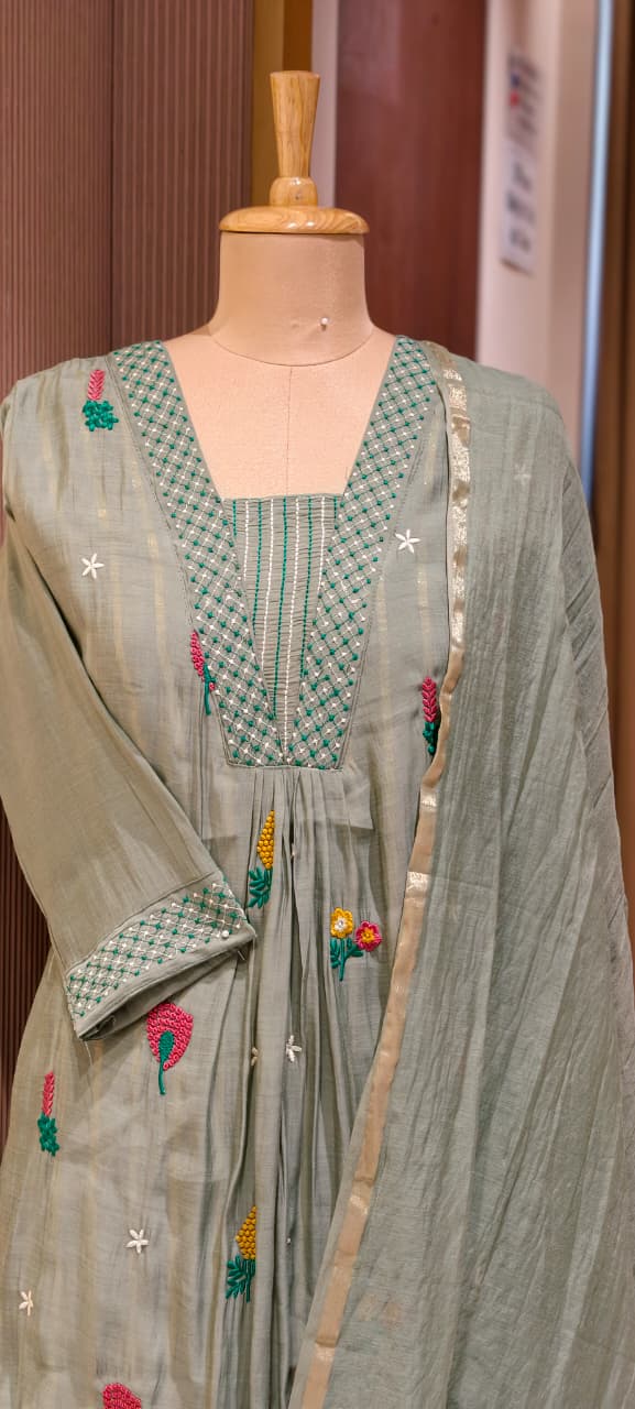 Cute Scattered Motifs With Linear Neckline Surat Mul-Chanderi A-Line Full Suit Set With Dupatta- 15804