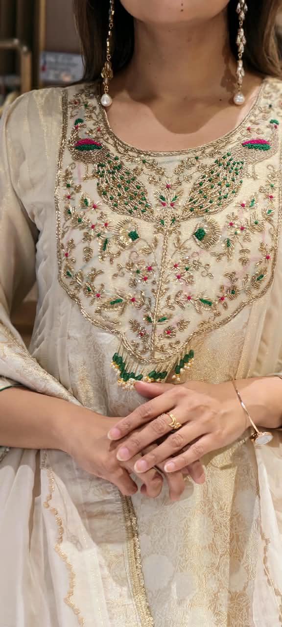 Traditional Brocade and Tissue Silk Anarkali Suit featuring Peacock Zardozi Work and Emerald Bead Accents- 16585
