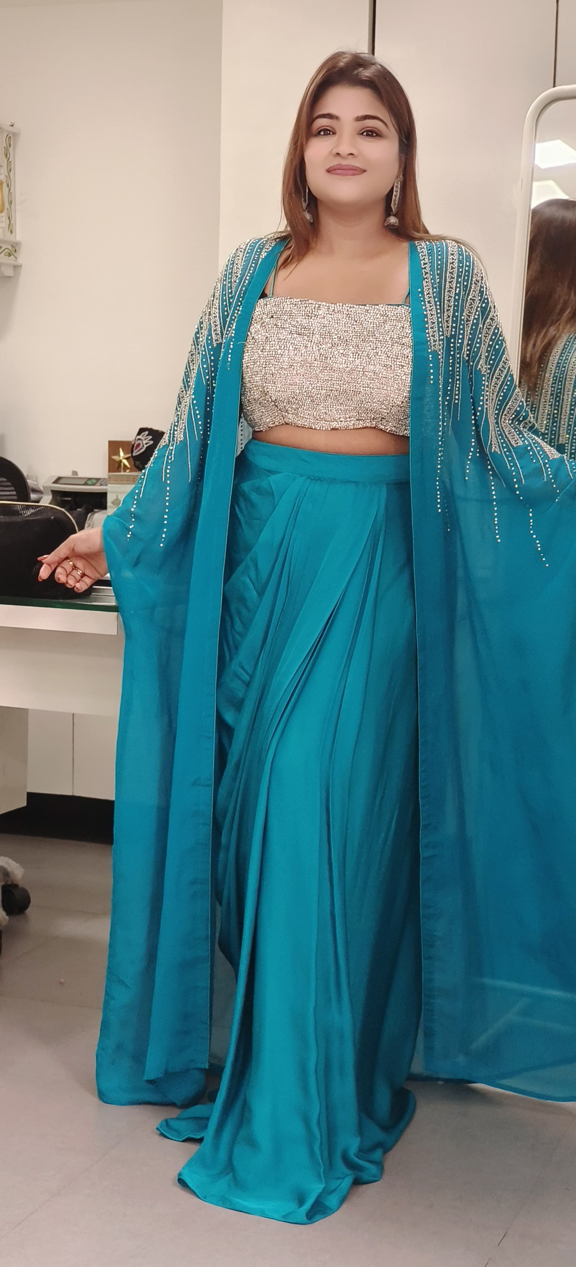 Swarovski-Embellished Top with Draped Skirt Set With organza shrug A luxurious outfit featuring a sparkling Swarovski stone-studded blouse paired with an elegant drape-style skirt DRY WASH