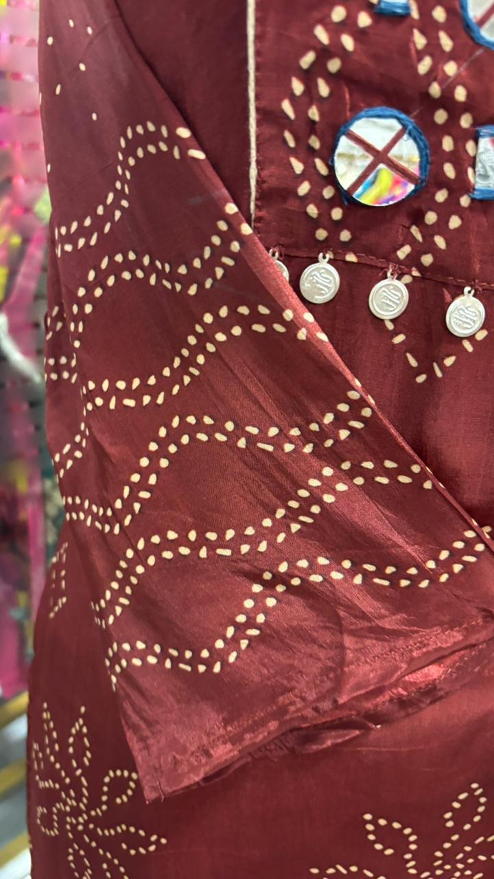 Beautiful Foil Mirror Work Tasselled Full Suit With Ajrak Print Dupatta In Crepe Fabric