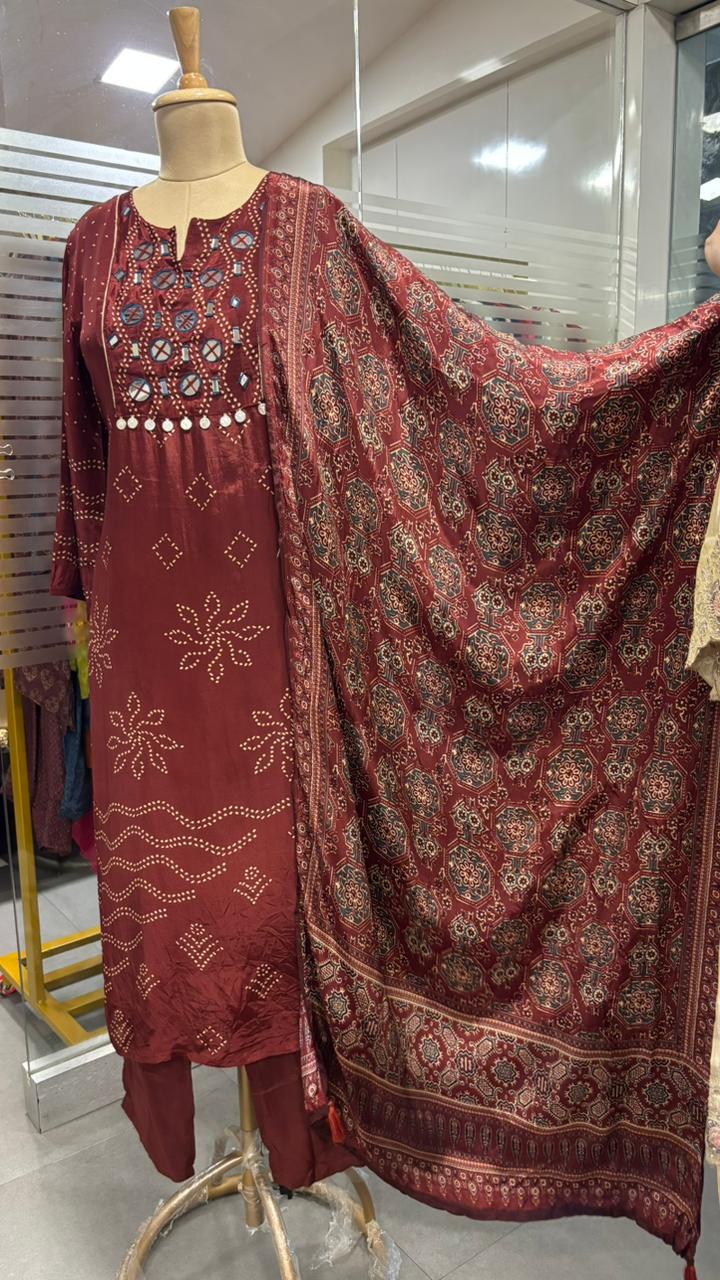 Beautiful Foil Mirror Work Tasselled Full Suit With Ajrak Print Dupatta In Crepe Fabric
