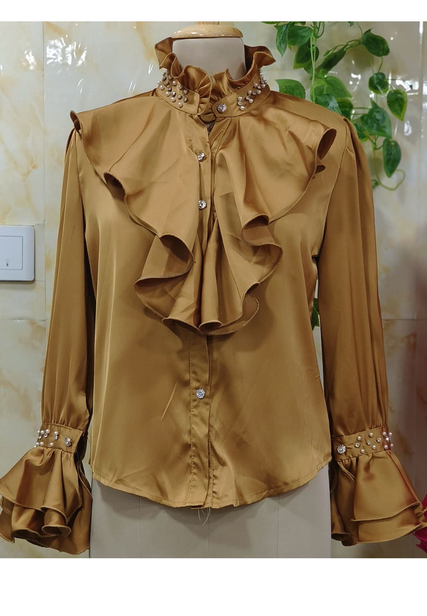 High ruffled collars with pearl embellishments-
