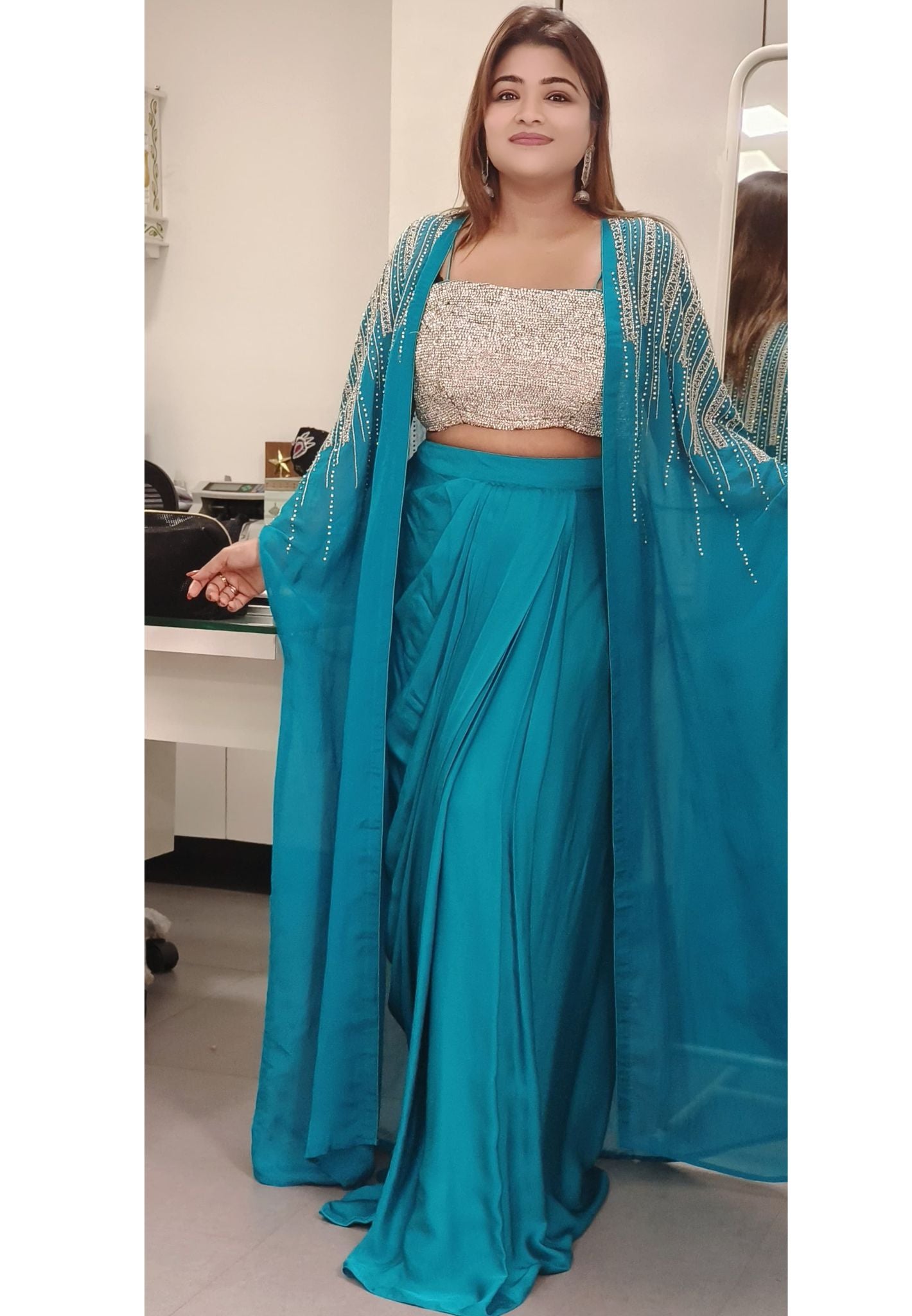 Swarovski-Embellished Top with Draped Skirt Set With organza shrug  A luxurious outfit featuring a sparkling Swarovski stone-studded blouse paired with an elegant drape-style skirt DRY WASH