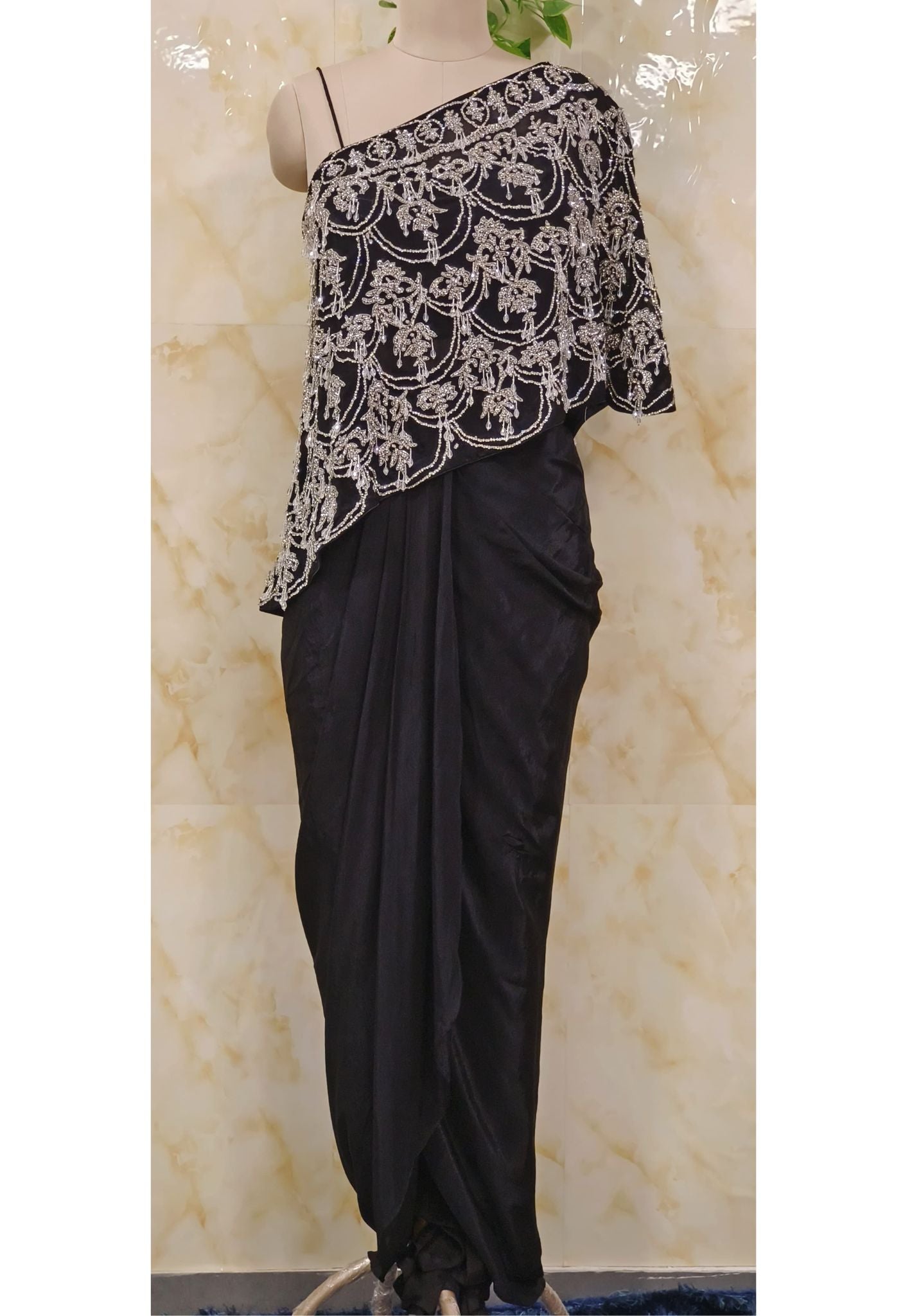 Black Off-Shoulder Embroidered Indo-Western Outfit A stylish and elegant Indo-Western outfit crafted from premium crepe fabric, featuring intricate embroidery off-shoulder design.