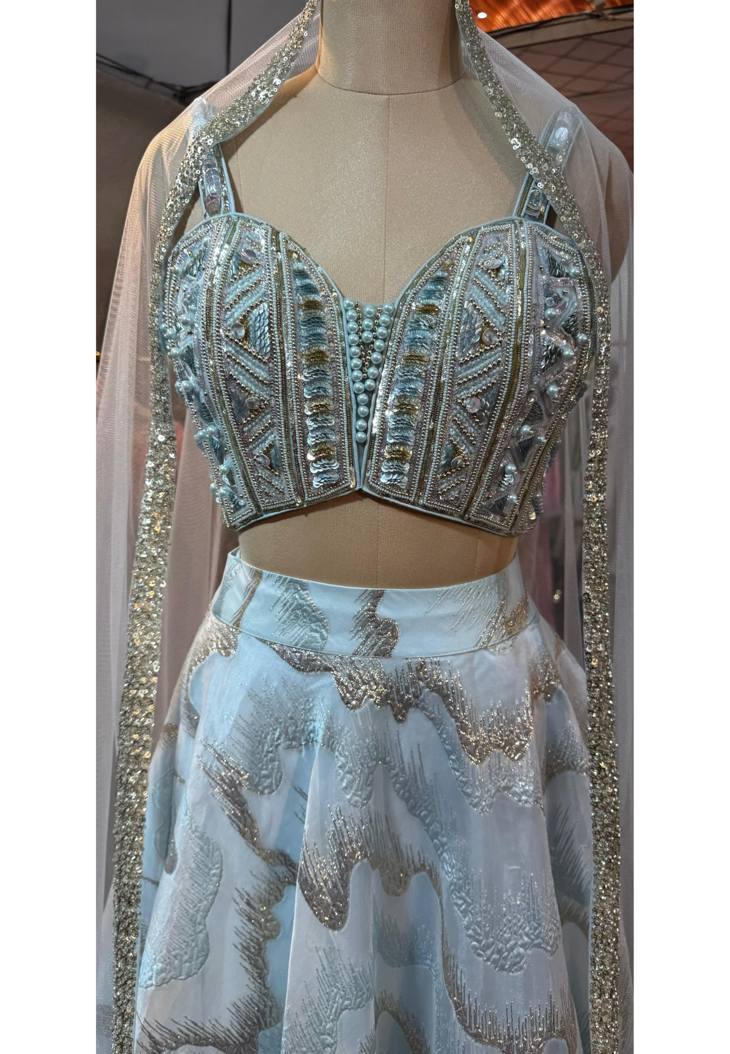 Radiant Sky Bliss Party Wear Shimmery Embellished Lehenga With Handwork Sleeveless Blouse & Netted Dupatta- 11165