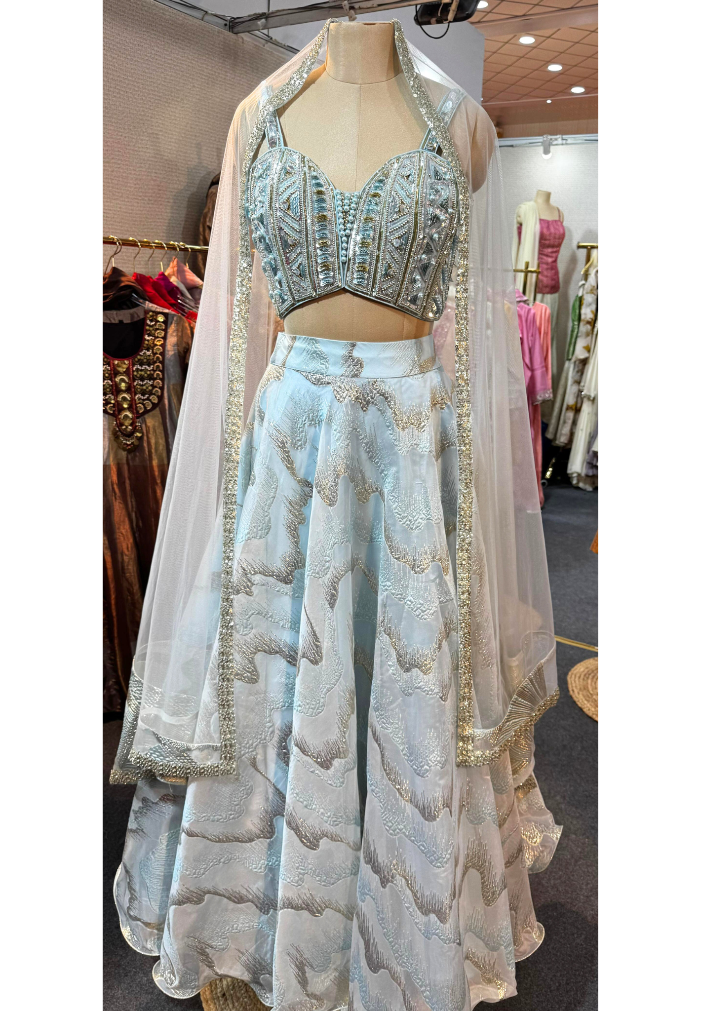 Radiant Sky Bliss Party Wear Shimmery Embellished Lehenga With Handwork Sleeveless Blouse & Netted Dupatta- 11165