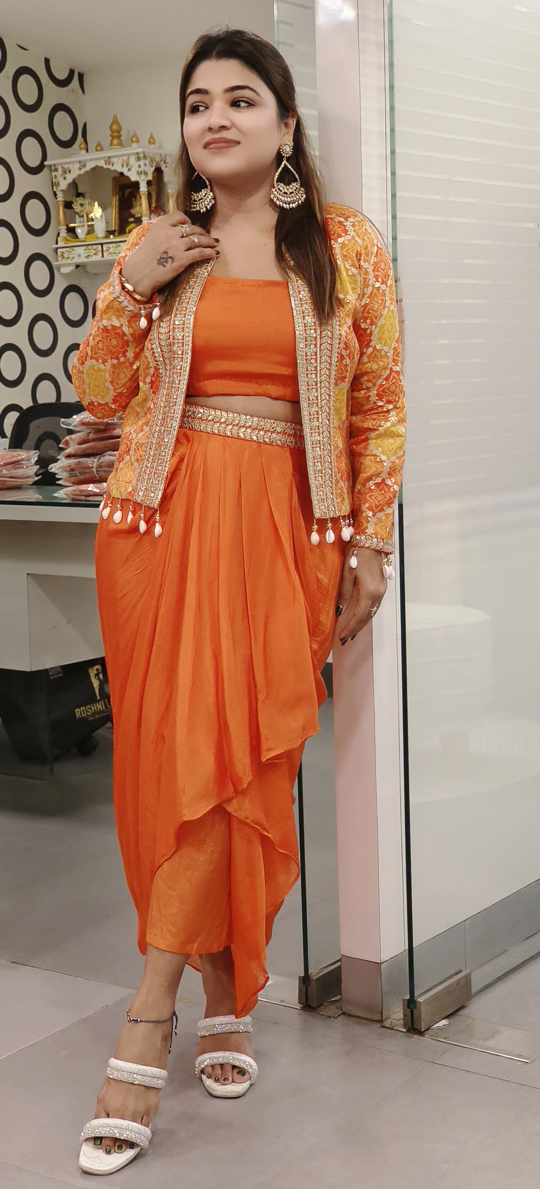 "Orange Ethnic Ensemble with Embroidered Jacket and Pearl Detailing"