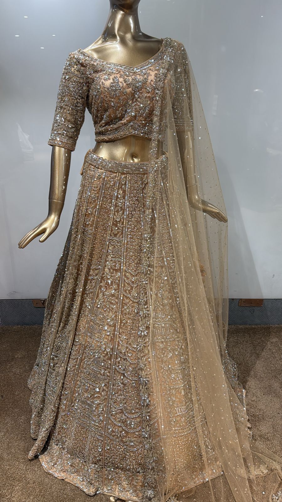 Ethereal Elegance Champagne Gold Hand-Embroidered Lehenga with Intricate Sequin & Crystal Detailing