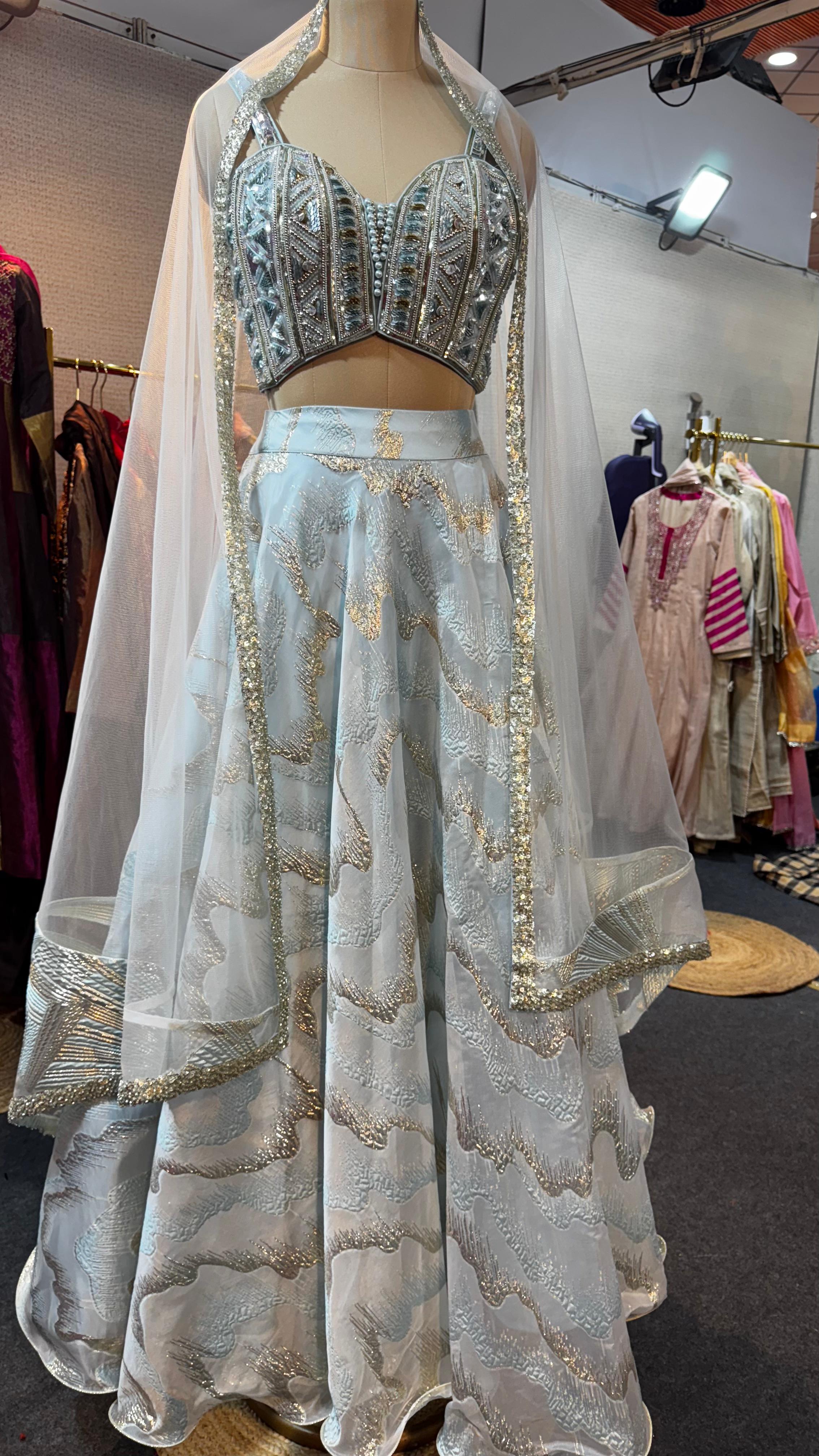 Radiant Sky Bliss Party Wear Shimmery Embellished Lehenga With Handwork Sleeveless Blouse & Netted Dupatta- 11165