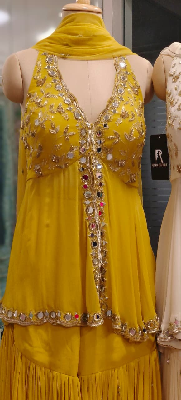Graceful Real Mirror Sleeveless Front Slitted Short Kurta With Sharara Bottom & Dupatta In Georgette Fabric