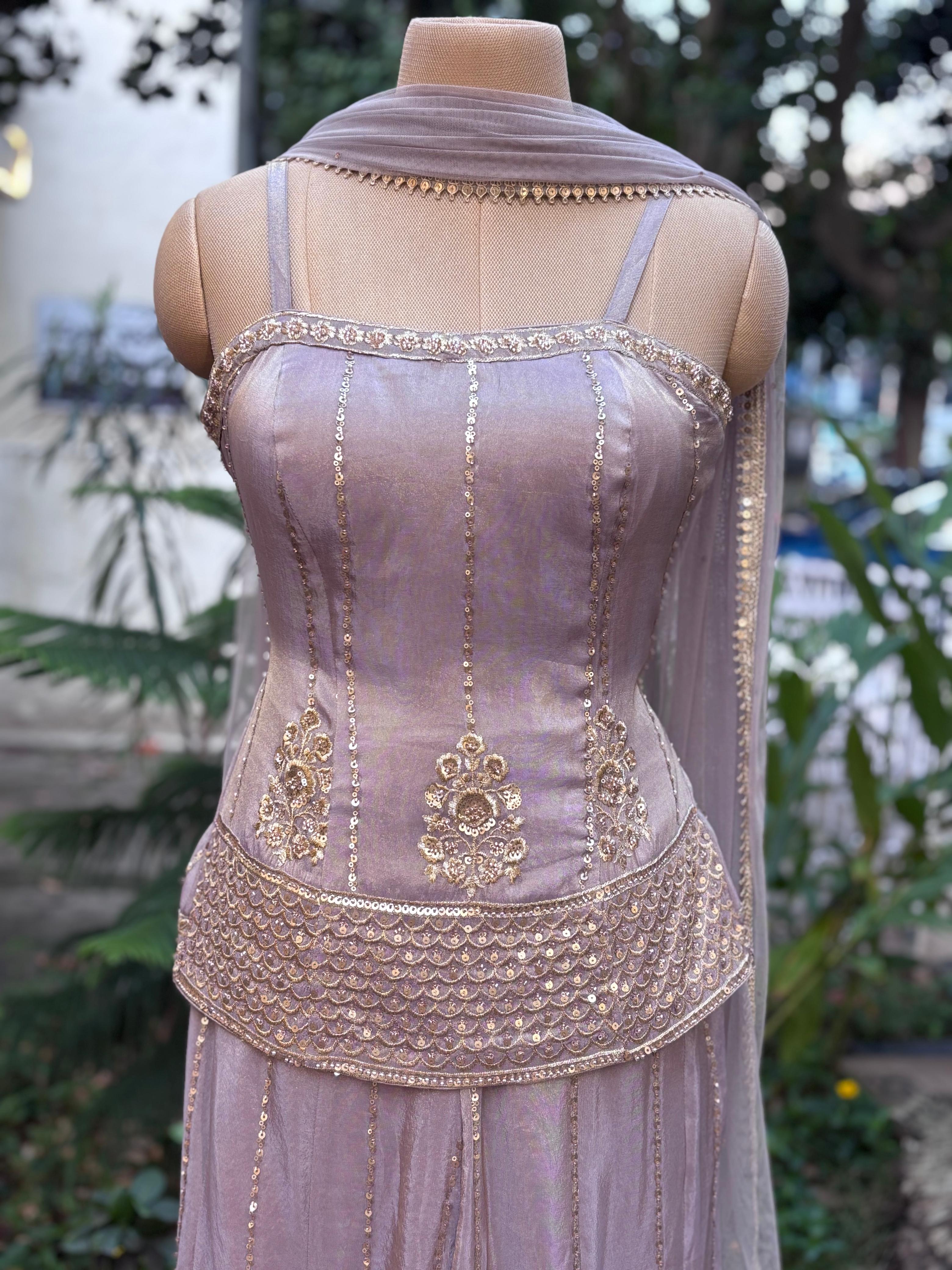 Zardosi Charm Tiny Foil Handwork Sleeveless Short Kurta With Loose Palazzo Bottom In Tissue Fabric & Netted Dupatta-