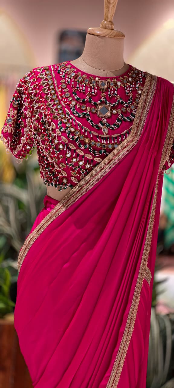 Rani Pink Pre-Draped Saree with Fine Gold Gotta Border Paired with Luxury Hand-Embroidered Jeweled Blouse Featuring Emerald & Polki Motifs- 14777