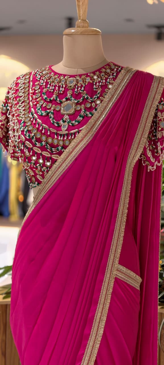 Rani Pink Pre-Draped Saree with Fine Gold Gotta Border Paired with Luxury Hand-Embroidered Jeweled Blouse Featuring Emerald & Polki Motifs- 14777