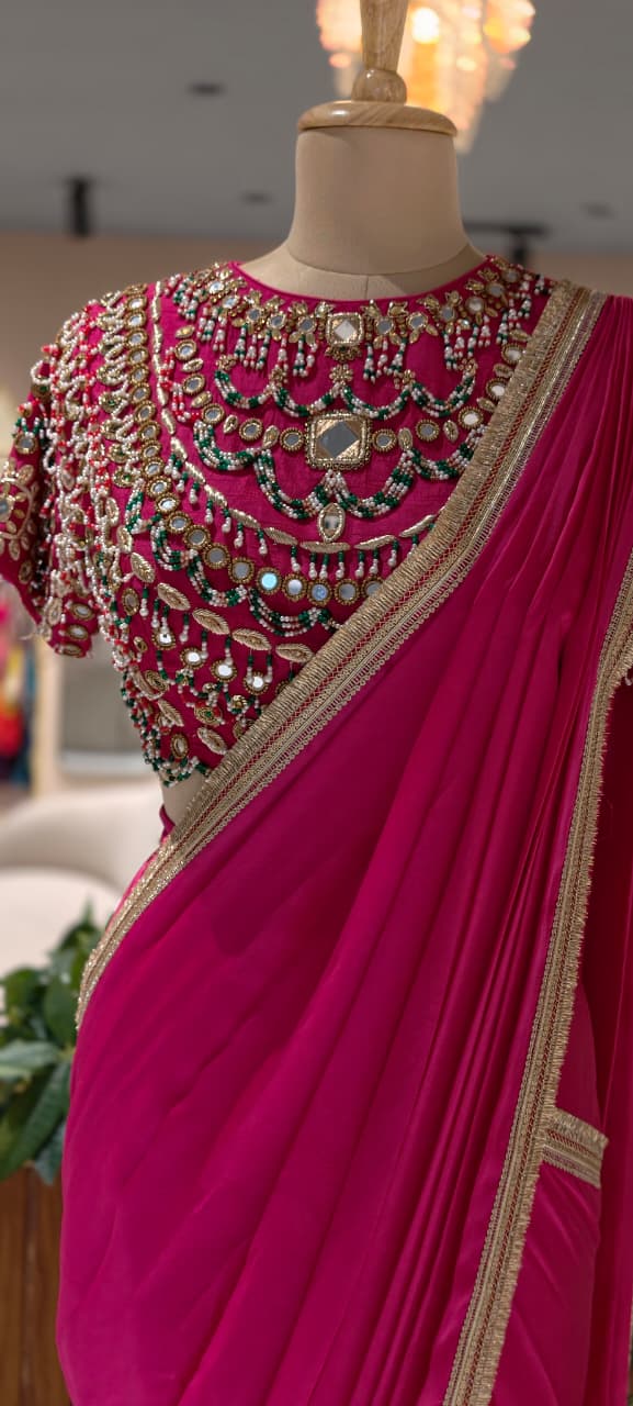 Rani Pink Pre-Draped Saree with Fine Gold Gotta Border Paired with Luxury Hand-Embroidered Jeweled Blouse Featuring Emerald & Polki Motifs- 14777