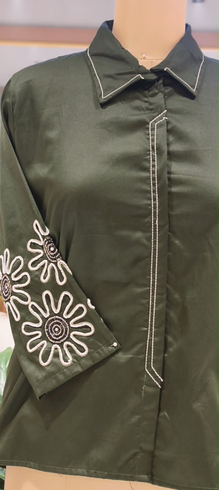 Dark Green Collared High-Low Tunic Shirt with White Contrast Stitching & Floral Sunburst Sleeve Embroidery- 16117
