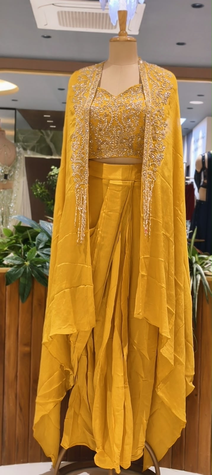 Hand Embellished Bustier With Chinon Drape Skirt Set & Matching Flowy Cape Featuring Intricate Tassels Detailing- 16633