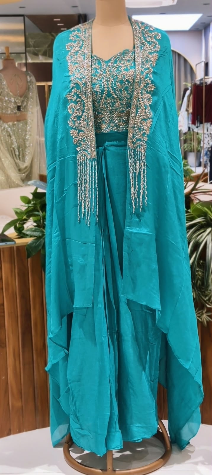 Hand Embellished Bustier With Chinon Drape Skirt Set & Matching Flowy Cape Featuring Intricate Tassels Detailing- 16633