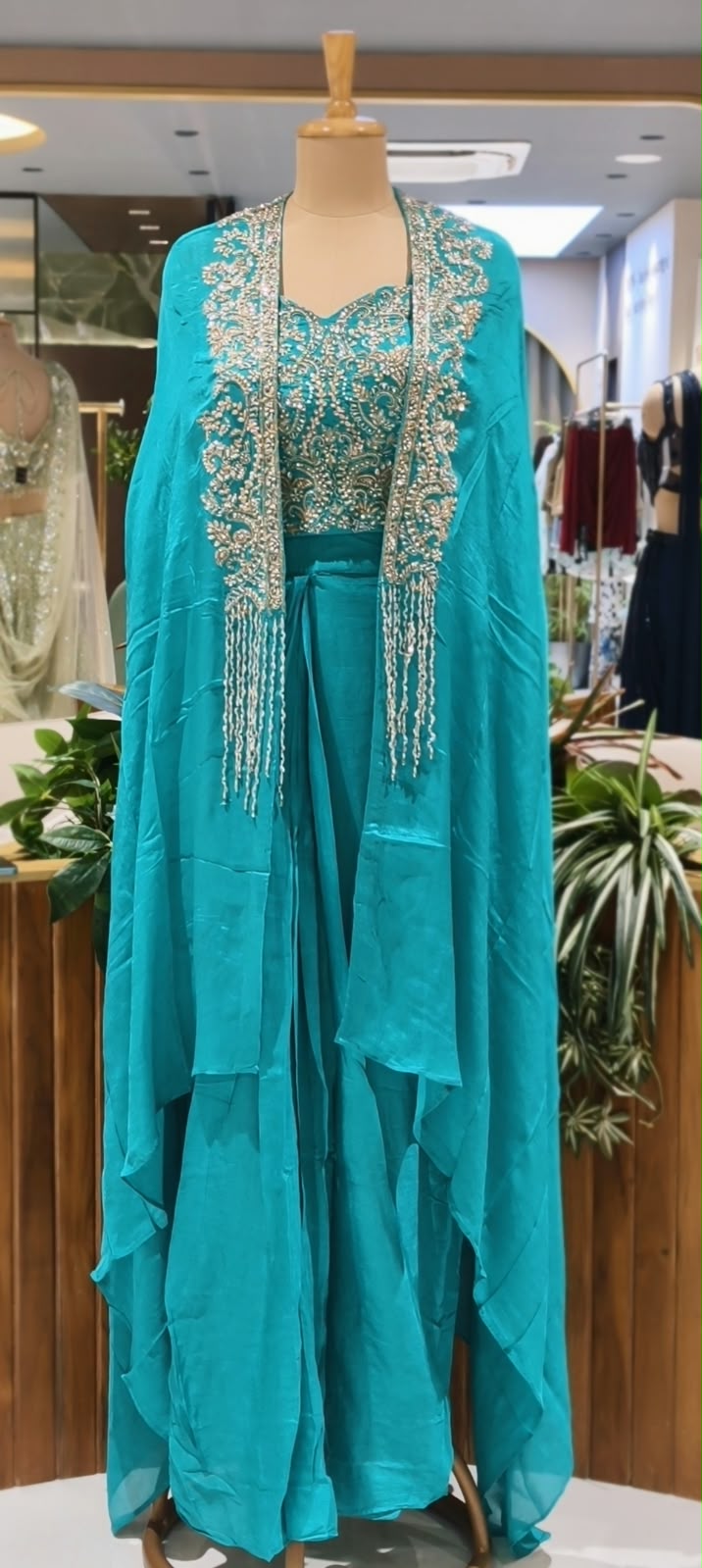 Hand Embellished Bustier With Chinon Drape Skirt Set & Matching Flowy Cape Featuring Intricate Tassels Detailing- 16633