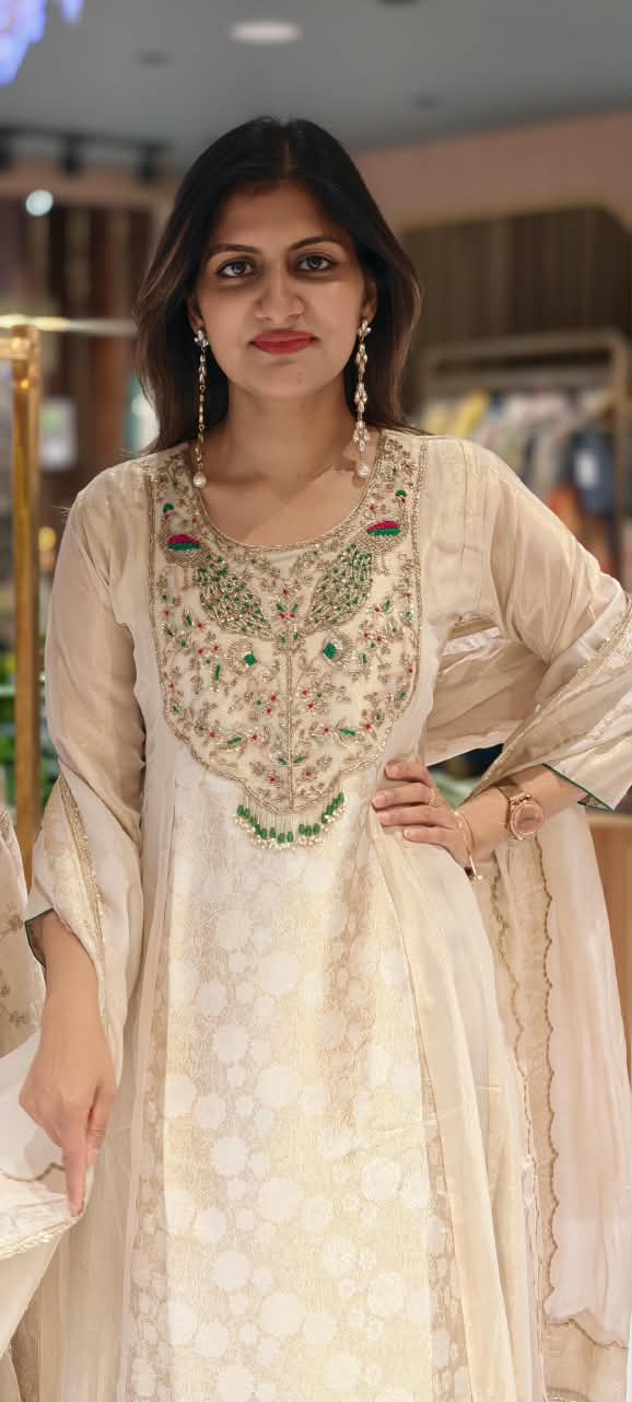 Traditional Brocade and Tissue Silk Anarkali Suit featuring Peacock Zardozi Work and Emerald Bead Accents- 16585