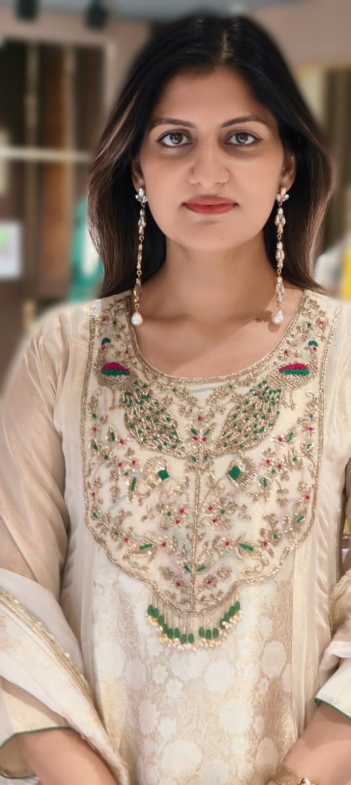 Traditional Brocade and Tissue Silk Anarkali Suit featuring Peacock Zardozi Work and Emerald Bead Accents- 16585