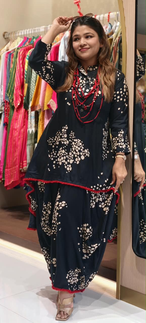 Black Polka Dot Printed Asymmetrical Layered Attached Cotton Indo-Wear with Red Tassel Lace Detailing and Statement Thread Necklace- 17022