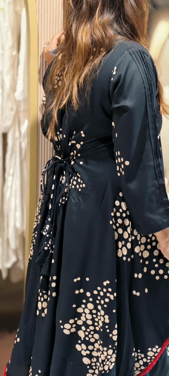 Black Polka Dot Printed Asymmetrical Layered Attached Cotton Indo-Wear with Red Tassel Lace Detailing and Statement Thread Necklace- 17022
