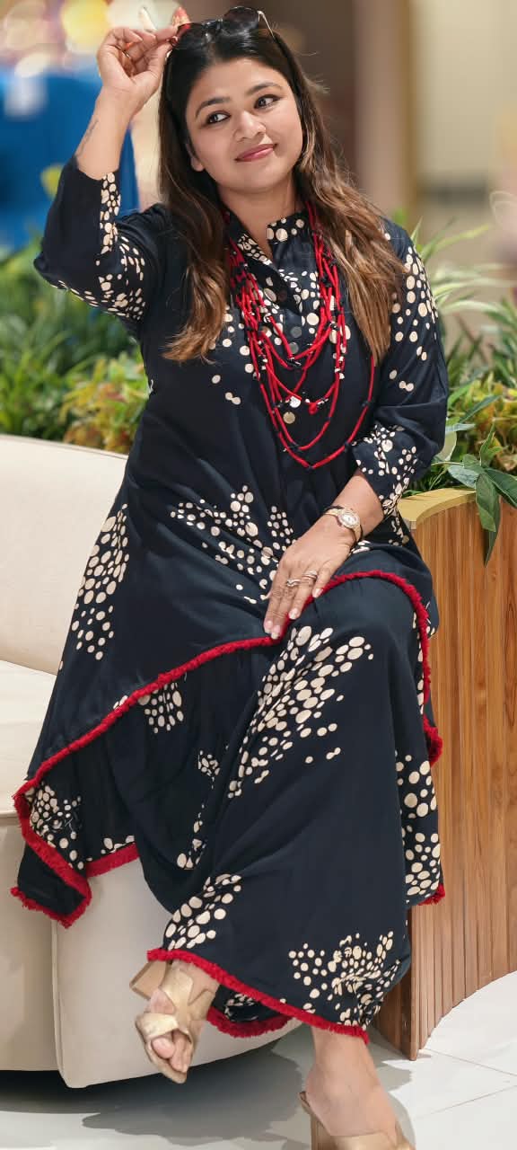 Black Polka Dot Printed Asymmetrical Layered Attached Cotton Indo-Wear with Red Tassel Lace Detailing and Statement Thread Necklace- 17022