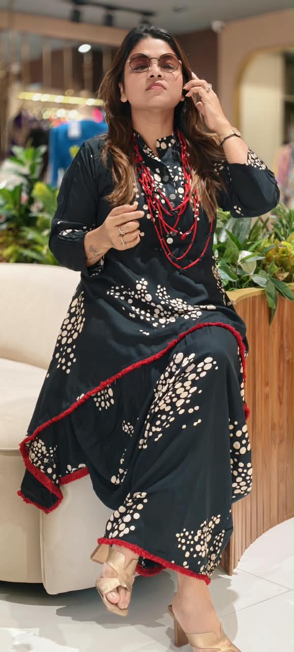 Black Polka Dot Printed Asymmetrical Layered Attached Cotton Indo-Wear with Red Tassel Lace Detailing and Statement Thread Necklace- 17022