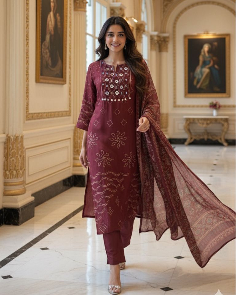 Beautiful Foil Mirror Work Tasselled Full Suit With Ajrak Print Dupatta In Crepe Fabric