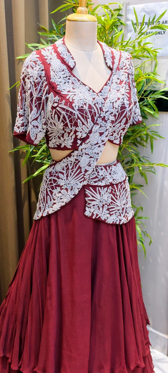 Deep Wine Georgette Multi-Tiered Ruffle Lehenga with Heavily Embroidered Silver Zardoz Asymmetric Overlap Blouse and Attach-Style Dupatta